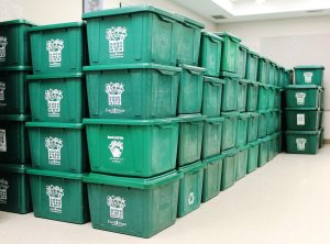 Stacks of good food bins in storage room